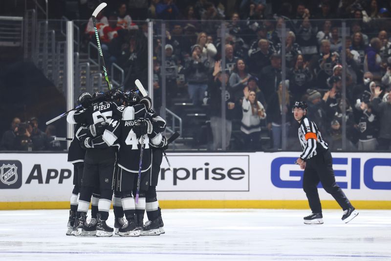 Dec 23, 2023; Los Angeles, California, USA; The Los Angeles Kings celebrate a goal by Los Angeles Kings right wing Quinton Byfield (55) against the Calgary Flames during the first period at Crypto.com Arena. Mandatory Credit: Jessica Alcheh-USA TODAY Sports