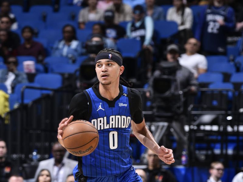 ORLANDO, FL - FEBRUARY 23:  Anthony Black #0 of the Orlando Magic handles the ball during the game against the Washington Wizards on February 23, 2025 at Kia Center in Orlando, Florida. NOTE TO USER: User expressly acknowledges and agrees that, by downloading and or using this photograph, User is consenting to the terms and conditions of the Getty Images License Agreement. Mandatory Copyright Notice: Copyright 2025 NBAE (Photo by Gary Bassing/NBAE via Getty Images)