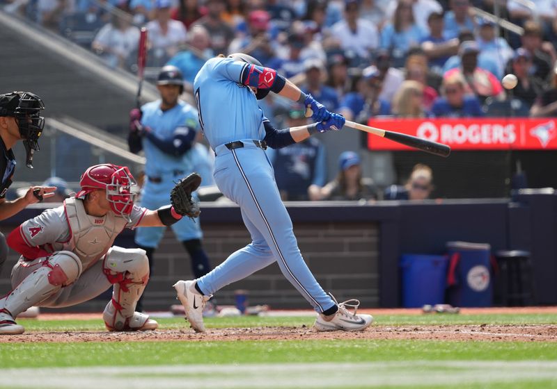 Aug 25, 2024; Toronto, Ontario, CAN; Toronto Blue Jays right fielder Addison Barger (47) hits a two run home run against the Los Angeles Angels during the sixth inning at Rogers Centre. Mandatory Credit: Nick Turchiaro-USA TODAY Sports