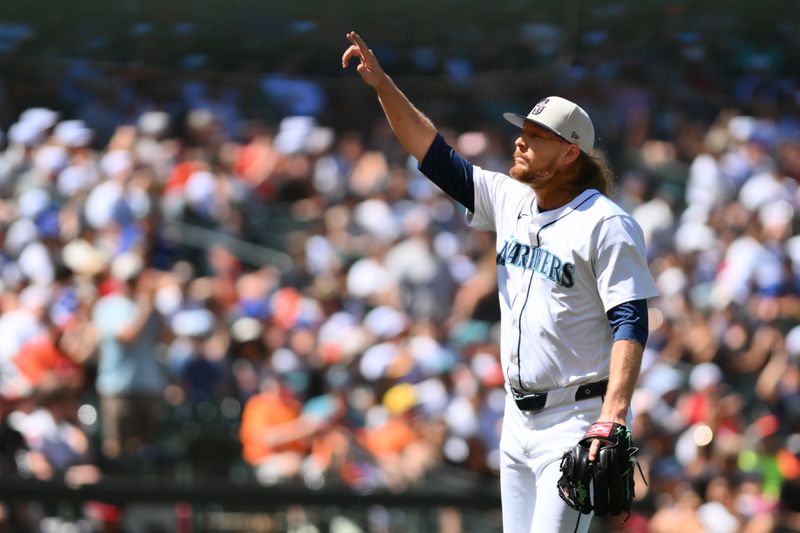 Jul 4, 2024; Seattle, Washington, USA; Seattle Mariners relief pitcher Ryne Stanek (45) celebrates the final out of the inning during the seventh inning against the Baltimore Orioles at T-Mobile Park. Mandatory Credit: Steven Bisig-USA TODAY Sports