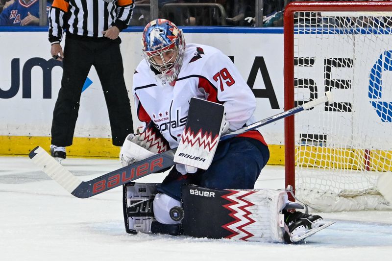 Apr 23, 2024; New York, New York, USA;  Washington Capitals goaltender Charlie Lindgren (79) makes a save against the New York Rangers during the first period in game two of the first round of the 2024 Stanley Cup Playoffs at Madison Square Garden. Mandatory Credit: Dennis Schneidler-USA TODAY Sports