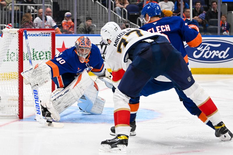 Oct 26, 2024; Elmont, New York, USA;  New York Islanders goaltender Semyon Varlamov (40) makes a stick save against against the Florida Panthers during the third period at UBS Arena. Mandatory Credit: Dennis Schneidler-Imagn Images