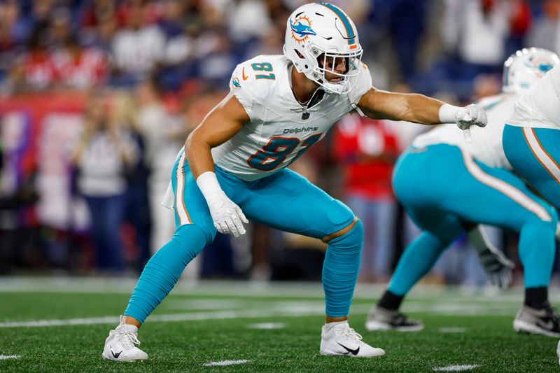 Miami Dolphins tight end Durham Smythe (81) anchors the line during warm-ups before an NFL football game against the New England Patriots on Sunday, Sept. 17, 2023, in Foxborough, Mass. (AP Photo/Greg M. Cooper)