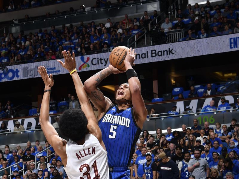 ORLANDO, FL - APRIL 27:  Paolo Banchero #5 of the Orlando Magic shoots the ball during the game against the Cleveland Cavaliers during Round 1 Game 4 of the 2024 NBA Playoffs on April 27, 2024 at the Kia Center in Orlando, Florida. NOTE TO USER: User expressly acknowledges and agrees that, by downloading and or using this photograph, User is consenting to the terms and conditions of the Getty Images License Agreement. Mandatory Copyright Notice: Copyright 2024 NBAE (Photo by Fernando Medina/NBAE via Getty Images)