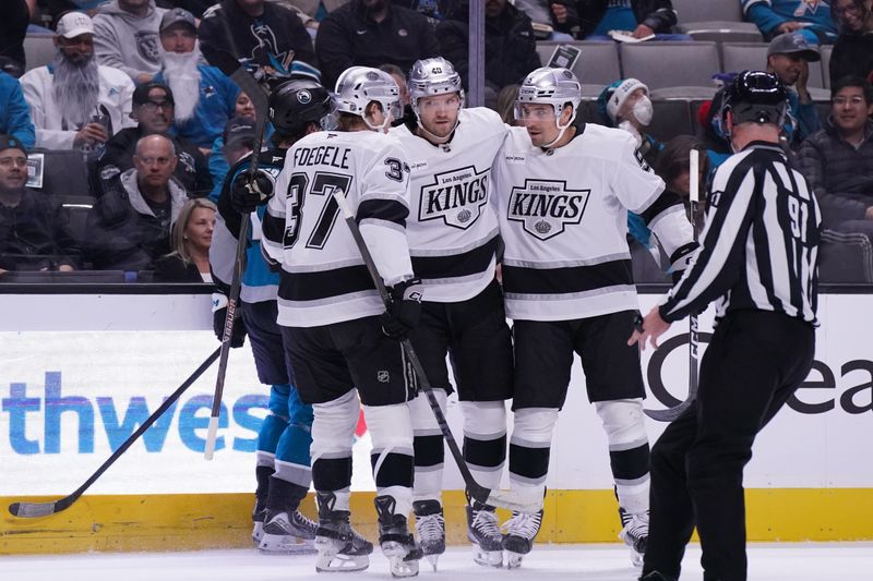 Nov 20, 2025; San Jose, California, USA;  Los Angeles Kings right winger Joel Armia (40) is congratulated by left winger Warren Foegele (37) and defenseman Cody Ceci (5) after scoring a goal in the first period against the San Jose Sharks at SAP Center at San Jose. Mandatory Credit: David Gonzales-Imagn Images