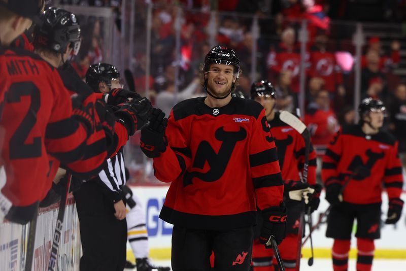 Mar 19, 2024; Newark, New Jersey, USA; New Jersey Devils center Dawson Mercer (91) celebrates his goal against the Pittsburgh Penguins during the first period at Prudential Center. Mandatory Credit: Ed Mulholland-USA TODAY Sports