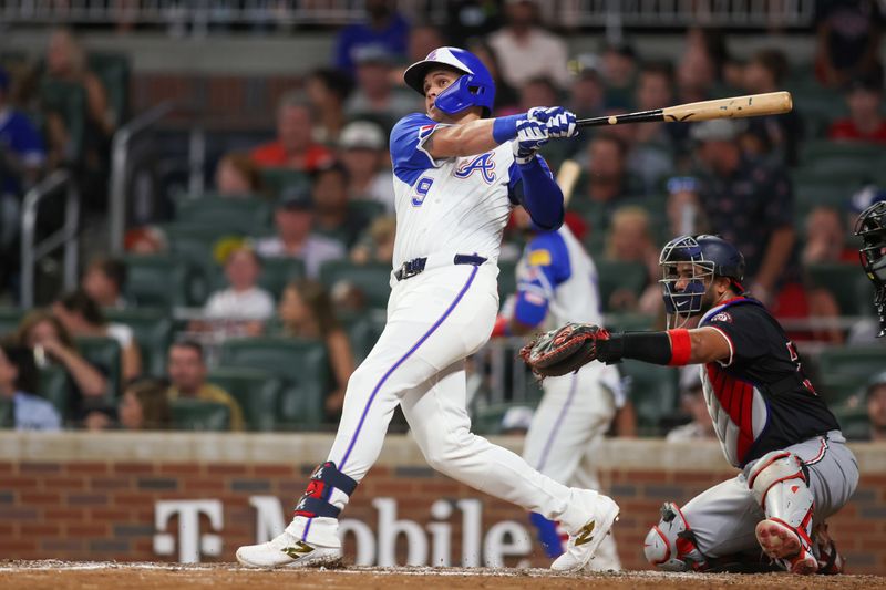 Aug 24, 2024; Atlanta, Georgia, USA; Atlanta Braves third baseman Gio Urshela (9) hits a single against the Washington Nationals in the sixth inning at Truist Park. Mandatory Credit: Brett Davis-USA TODAY Sports