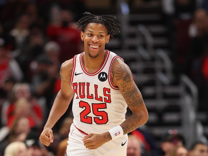 CHICAGO, ILLINOIS - DECEMBER 23: Dalen Terry #25 of the Chicago Bulls laughs against the Cleveland Cavaliers during the first half at the United Center on December 23, 2023 in Chicago, Illinois. NOTE TO USER: User expressly acknowledges and agrees that, by downloading and or using this photograph, User is consenting to the terms and conditions of the Getty Images License Agreement.  (Photo by Michael Reaves/Getty Images)