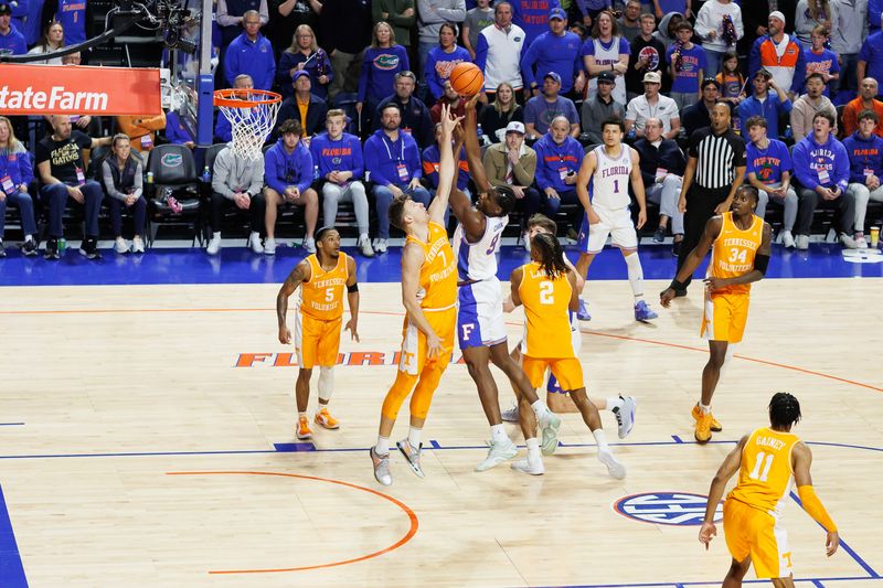 Jan 7, 2025; Gainesville, Florida, USA; Florida Gators center Rueben Chinyelu (9) shoots over Tennessee Volunteers forward Igor Milicic Jr. (7) during the first half at Exactech Arena at the Stephen C. O'Connell Center. Mandatory Credit: Matt Pendleton-Imagn Images