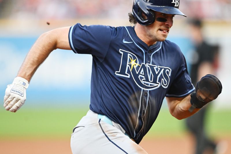 Sep 14, 2024; Cleveland, Ohio, USA; Tampa Bay Rays left fielder Josh Lowe (15) rounds third base in an attempt to score during the fifth inning against the Cleveland Guardians at Progressive Field. Mandatory Credit: Ken Blaze-Imagn Images