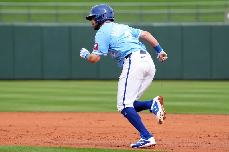 Mar 6, 2024; Surprise, Arizona, USA; Kansas City Royals shortstop Garrett Hampson (2) steals second base against the Seattle Mariners during the second inning at Surprise Stadium. Mandatory Credit: Joe Camporeale-USA TODAY Sports