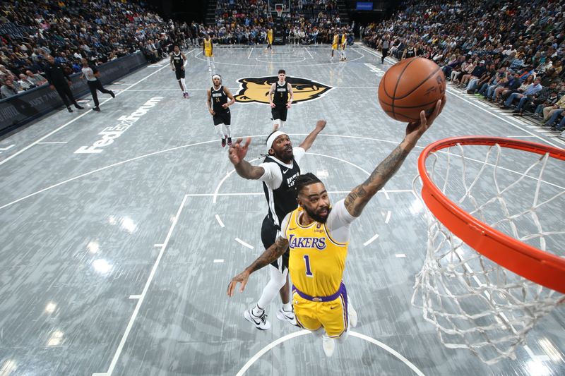 MEMPHIS, TN - MARCH 27: D'Angelo Russell #1 of the Los Angeles Lakers drives to the basket during the game against the Memphis Grizzlies on March 27, 2024 at FedExForum in Memphis, Tennessee. NOTE TO USER: User expressly acknowledges and agrees that, by downloading and or using this photograph, User is consenting to the terms and conditions of the Getty Images License Agreement. Mandatory Copyright Notice: Copyright 2024 NBAE (Photo by Joe Murphy/NBAE via Getty Images)