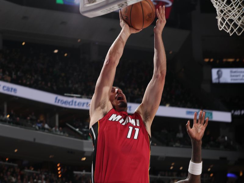MILWAUKEE, WI - FEBRUARY 13: Jaime Jaquez Jr. #11 of the Miami Heat drives to the basket during the game against the Milwaukee Bucks on February 13, 2024 at the Fiserv Forum Center in Milwaukee, Wisconsin. NOTE TO USER: User expressly acknowledges and agrees that, by downloading and or using this Photograph, user is consenting to the terms and conditions of the Getty Images License Agreement. Mandatory Copyright Notice: Copyright 2024 NBAE (Photo by Gary Dineen/NBAE via Getty Images).