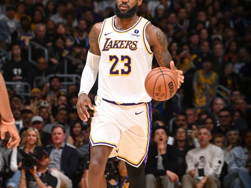 LOS ANGELES, CA - MARCH 16:  LeBron James #23 of the Los Angeles Lakers handles the ball during the game  on March 16, 2024 at Crypto.Com Arena in Los Angeles, California. NOTE TO USER: User expressly acknowledges and agrees that, by downloading and/or using this Photograph, user is consenting to the terms and conditions of the Getty Images License Agreement. Mandatory Copyright Notice: Copyright 2024 NBAE (Photo by Andrew D. Bernstein/NBAE via Getty Images)