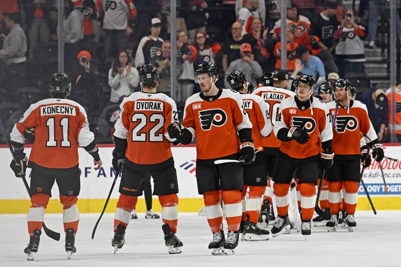 Mar 26, 2026; Philadelphia, Pennsylvania, USA; Philadelphia Flyers defenseman Nick Seeler (24) celebrates win with teammates against the Chicago Blackhawks at Xfinity Mobile Arena. Mandatory Credit: Eric Hartline-Imagn Images