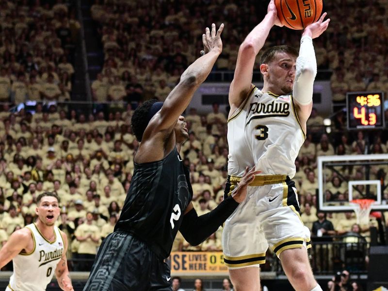 Mar 2, 2024; West Lafayette, Indiana, USA; Purdue Boilermakers guard Braden Smith (3) passes the ball away from Michigan State Spartans guard Tyson Walker (2) during the second half at Mackey Arena. Mandatory Credit: Marc Lebryk-USA TODAY Sports