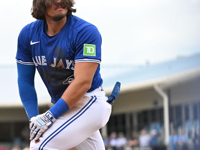 Mar 22, 2024; Dunedin, Florida, USA; Toronto Blue Jays left fielder Nathan Lukes (38) reacts after getting called out at third base in the second inning of the spring training game against the Boston Red Sox at TD Ballpark. Mandatory Credit: Jonathan Dyer-USA TODAY Sports