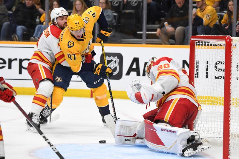 Jan 4, 2024; Nashville, Tennessee, USA; Nashville Predators right wing Michael McCarron (47) has a wrap around shot blocked by Calgary Flames goaltender Dan Vladar (80) during the third period at Bridgestone Arena. Mandatory Credit: Christopher Hanewinckel-USA TODAY Sports