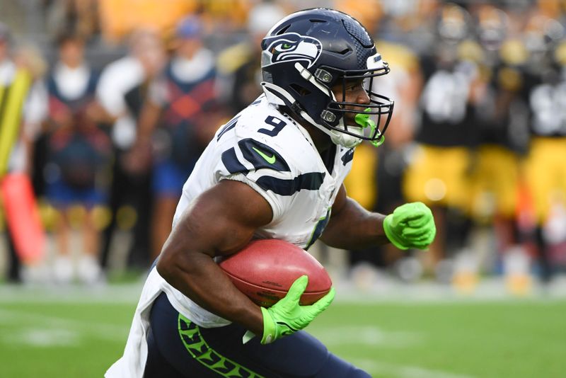 Seattle Seahawks running back Kenneth Walker III (9) runs against the Pittsburgh Steelers during the first half of an NFL preseason football game, Saturday, Aug. 13, 2022, in Pittsburgh. (AP Photo/Barry Reeger)