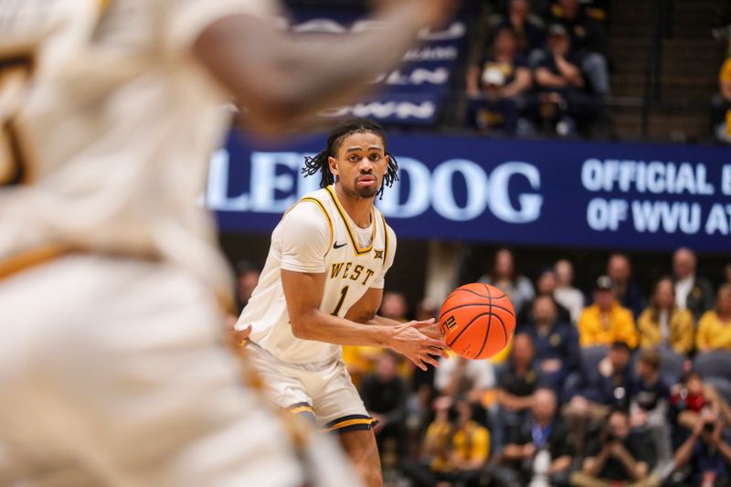 Feb 28, 2026; Morgantown, West Virginia, USA; West Virginia Mountaineers guard Jasper Floyd (1) looks to pass during the second half against the BYU Cougars at Hope Coliseum. Mandatory Credit: Ben Queen-Imagn Images