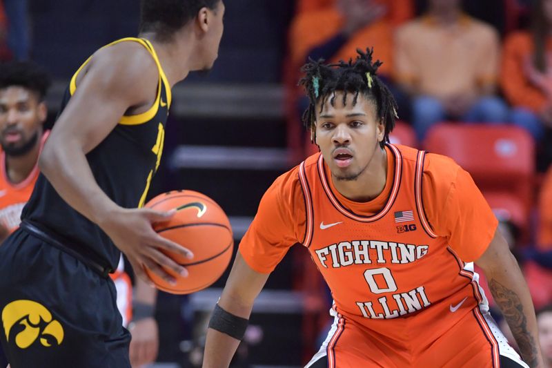 Feb 24, 2024; Champaign, Illinois, USA;  Illinois Fighting Illini guard Terrence Shannon Jr. (0) eyes the ball as Iowa Hawkeyes guard Tony Perkins (11) brings it up court during the first half at State Farm Center. Mandatory Credit: Ron Johnson-USA TODAY Sports