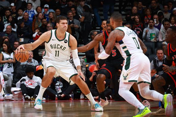 TORONTO, CANADA - NOVEMBER 15:  Brook Lopez #11 of the Milwaukee Bucks handles the ball during the game against the Toronto Raptors on November 15, 2023 at the Scotiabank Arena in Toronto, Ontario, Canada.  NOTE TO USER: User expressly acknowledges and agrees that, by downloading and or using this Photograph, user is consenting to the terms and conditions of the Getty Images License Agreement.  Mandatory Copyright Notice: Copyright 2023 NBAE (Photo by Vaughn Ridley/NBAE via Getty Images)