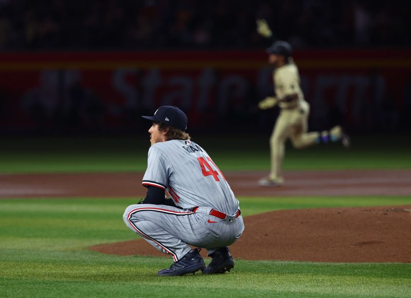 Jun 25, 2024; Phoenix, Arizona, USA; Minnesota Twins pitcher Joe Ryan reacts after giving up a home run to Arizona Diamondbacks infielder Ketel Marte in the first inning at Chase Field. Mandatory Credit: Mark J. Rebilas-USA TODAY Sports