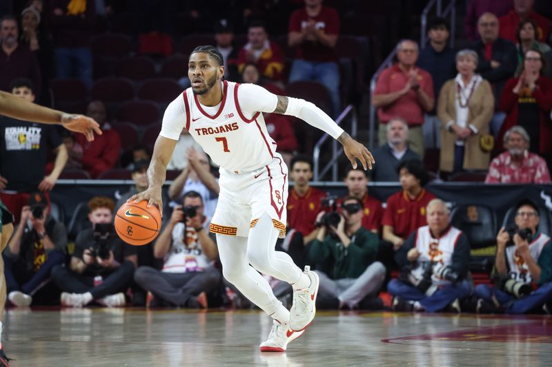 Feb 1, 2025; Los Angeles, California, USA;  USC Trojans guard Chibuzo Agbo (7) dribbles down the court against the Michigan State Spartans during the first half at Galen Center. Mandatory Credit: William Navarro-Imagn Images