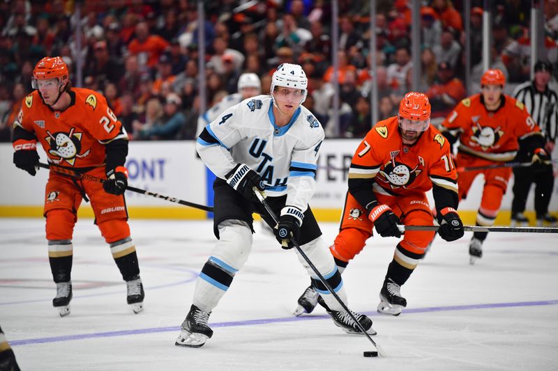 Oct 16, 2024; Anaheim, California, USA; Utah Hockey Club defenseman Juuso Valimaki (4) controls the puck against the Anaheim Ducks during the third period at Honda Center. Mandatory Credit: Gary A. Vasquez-Imagn Images