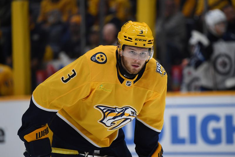 Nov 26, 2023; Nashville, Tennessee, USA; Nashville Predators defenseman Jeremy Lauzon (3) waits for a face off during the first period against the Winnipeg Jets at Bridgestone Arena. Mandatory Credit: Christopher Hanewinckel-USA TODAY Sports