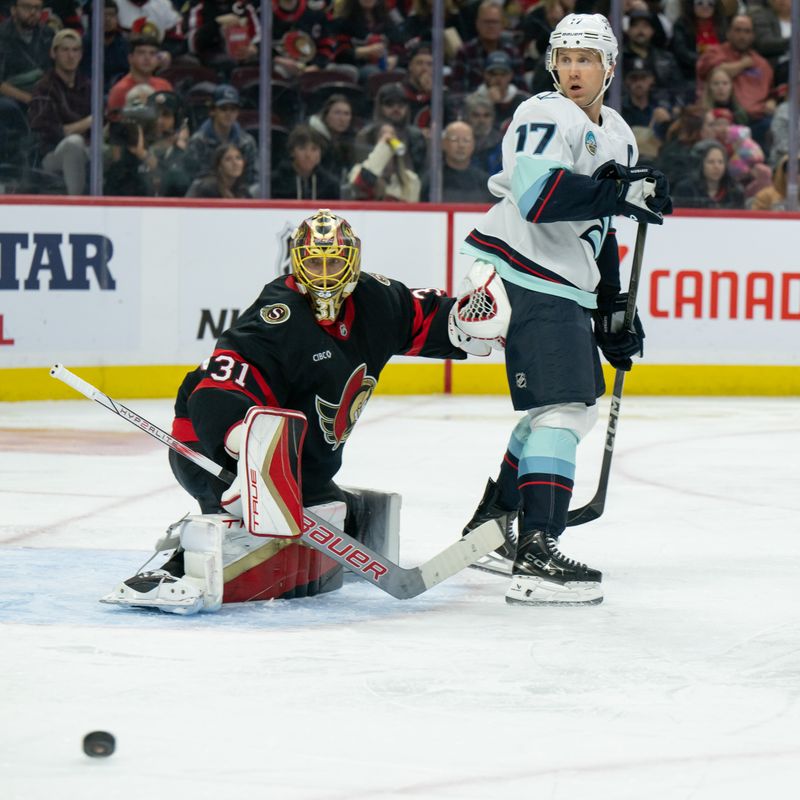 Nov 2, 2024; Ottawa, Ontario, CAN; Ottawa Senators goalie Anton Forsberg (31) and Seattle Kraken center Jaden Schwartz (17) follow the puck in the second period at the Canadian Tire Centre. Mandatory Credit: Marc DesRosiers-Imagn Images