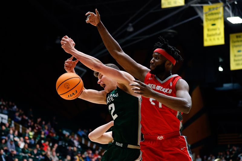 Mar 3, 2023; Fort Collins, Colorado, USA; Colorado State Rams forward Patrick Cartier (12) and New Mexico Lobos forward Morris Udeze (24) battle for a rebound in the first half at Moby Arena. Mandatory Credit: Isaiah J. Downing-USA TODAY Sports