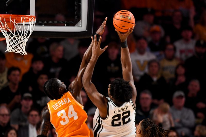 Jan 18, 2025; Nashville, Tennessee, USA;  Tennessee Volunteers forward Felix Okpara (34) blocks the shot of Vanderbilt Commodores forward Jaylen Carey (22) during the second half at Memorial Gymnasium. Mandatory Credit: Steve Roberts-Imagn Images