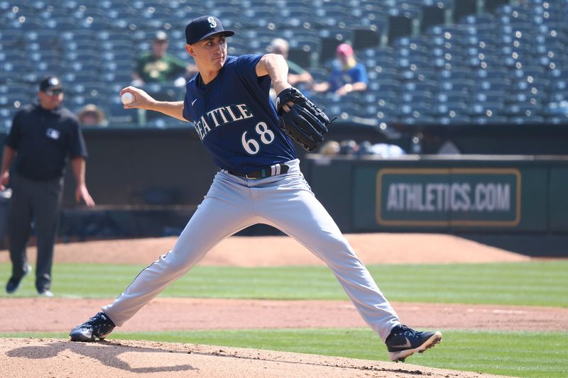 Sep 20, 2023; Oakland, California, USA; Seattle Mariners starting pitcher George Kirby (68) pitches against the Oakland Athletics during the first inning at Oakland-Alameda County Coliseum. Mandatory Credit: Kelley L Cox-USA TODAY Sports