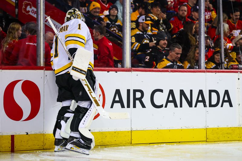 Dec 29, 2025; Calgary, Alberta, CAN; Boston Bruins goaltender Jeremy Swayman (1) inspecting the boards prior to the second period against the Calgary Flames at Scotiabank Saddledome. Mandatory Credit: Sergei Belski-Imagn Images