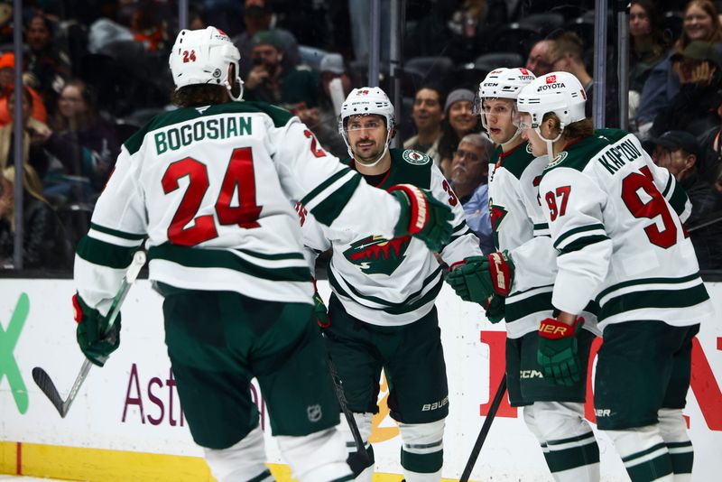 Nov 8, 2024; Anaheim, California, USA; Minnesota Wild center Marco Rossi (23) celebrates with his teammates after a goal during the third period of a hockey game against the Anaheim Ducks at Honda Center. Mandatory Credit: Jessica Alcheh-Imagn Images