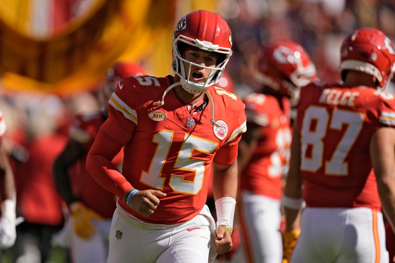 Kansas City Chiefs quarterback Patrick Mahomes runs onto the field before an NFL football game against the Chicago Bears Sunday, Sept. 24, 2023, in Kansas City, Mo. (AP Photo/Charlie Riedel)