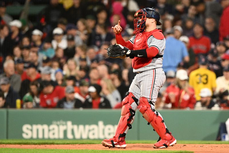 Sep 20, 2024; Boston, Massachusetts, USA; Minnesota Twins catcher Christian Vazquez (8) signals a pitch during the fourth inning against the Boston Red Sox at Fenway Park. Mandatory Credit: Brian Fluharty-Imagn Images