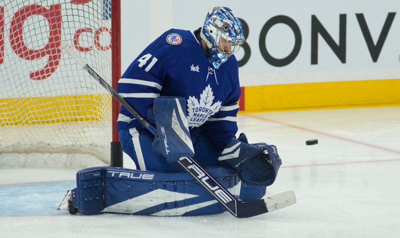 Nov 8, 2024; Toronto, Ontario, CAN; Toronto Maple Leafs goaltender Anthony Stolarz (41) makes a save during warm up before a game against the Detroit Red Wings at Scotiabank Arena. Mandatory Credit: John E. Sokolowski-Imagn Images