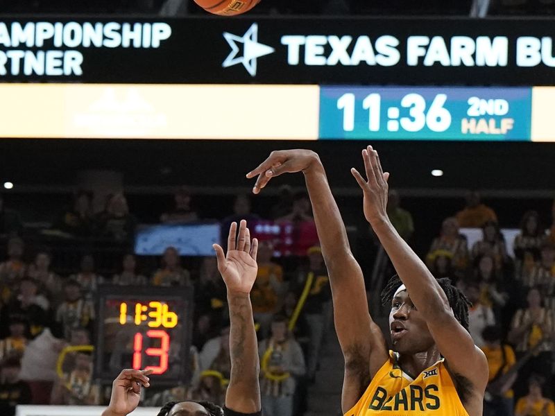 Jan 13, 2024; Waco, Texas, USA; Baylor Bears guard Ja'Kobe Walter (4) shoots over Cincinnati Bearcats guard Jizzle James (2) during the second half at Paul and Alejandra Foster Pavilion. Mandatory Credit: Raymond Carlin III-USA TODAY Sports