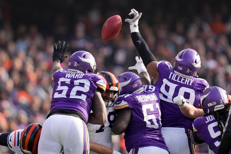 Minnesota Vikings defensive tackle Jerry Tillery (99) blocks a field goal attempt by Chicago Bears place kicker Cairo Santos during the first half of an NFL football game Sunday, Nov. 24, 2024, in Chicago. (AP Photo/Erin Hooley)