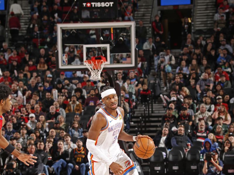 PORTLAND, OR - JANUARY 26: Shai Gilgeous-Alexander #2 of the Oklahoma City Thunder handles the ball during the game against the Portland Trail Blazers on January 26, 2025 at the Moda Center Arena in Portland, Oregon. NOTE TO USER: User expressly acknowledges and agrees that, by downloading and or using this photograph, user is consenting to the terms and conditions of the Getty Images License Agreement. Mandatory Copyright Notice: Copyright 2025 NBAE (Photo by Cameron Browne/NBAE via Getty Images)