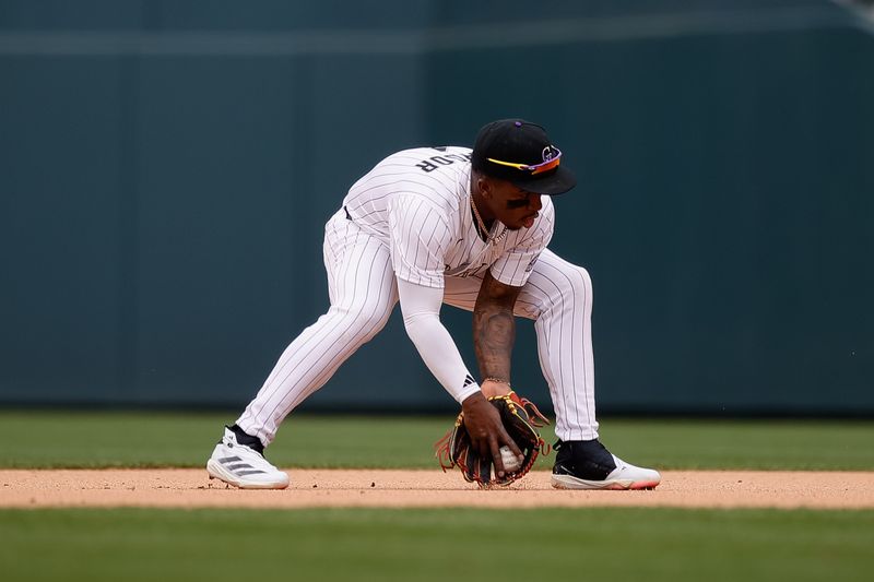 Apr 30, 2025; Denver, Colorado, USA; Colorado Rockies second baseman Adael Amador (1) fields the ball in the eighth inning against the Atlanta Braves at Coors Field. Mandatory Credit: Isaiah J. Downing-Imagn Images