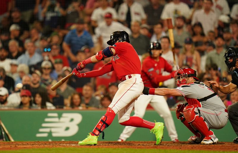 Jun 1, 2023; Boston, Massachusetts, USA; Boston Red Sox shortstop Enrique Hernandez (5) singles to right field to drive in two runs against the Cincinnati Reds in the eighth inning at Fenway Park. Mandatory Credit: David Butler II-USA TODAY Sports