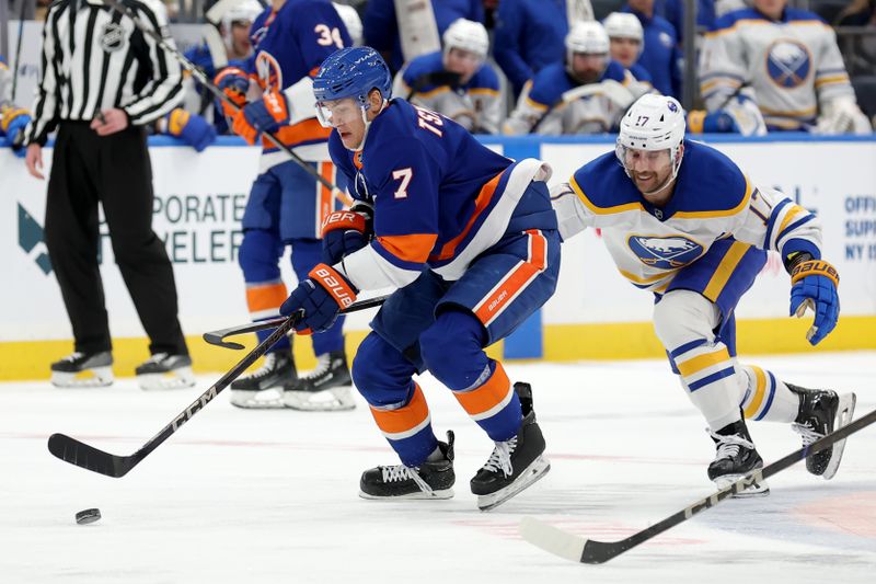 Nov 30, 2024; Elmont, New York, USA; New York Islanders right wing Maxim Tsyplakov (7) skates with the puck against Buffalo Sabres left wing Jason Zucker (17) during the second period at UBS Arena. Mandatory Credit: Brad Penner-Imagn Images