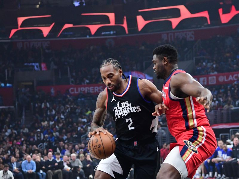 LOS ANGELES, CA - FEBRUARY 7: Kawhi Leonard #2 of the LA Clippers drives to the basket against Zion Williamson #1 of the New Orleans Pelicans during the game on February 7, 2024 at Crypto.Com Arena in Los Angeles, California. NOTE TO USER: User expressly acknowledges and agrees that, by downloading and/or using this Photograph, user is consenting to the terms and conditions of the Getty Images License Agreement. Mandatory Copyright Notice: Copyright 2024 NBAE (Photo by Adam Pantozzi/NBAE via Getty Images)