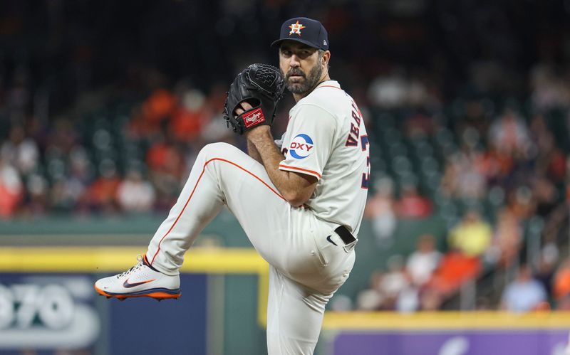 May 1, 2024; Houston, Texas, USA;  Houston Astros starting pitcher Justin Verlander (35) delivers a pitch during the second inning against the Cleveland Guardians at Minute Maid Park. Mandatory Credit: Troy Taormina-USA TODAY Sports