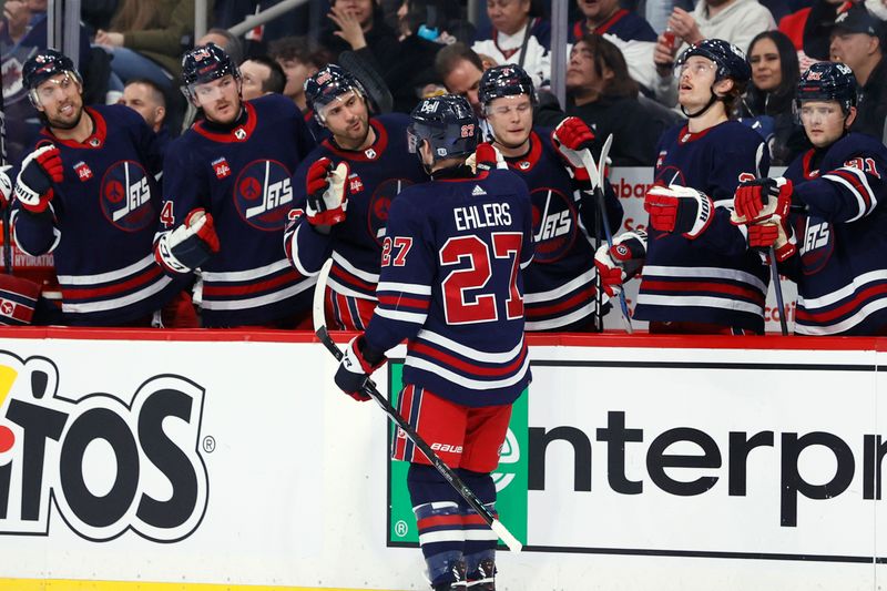 Dec 20, 2023; Winnipeg, Manitoba, CAN; Winnipeg Jets left wing Nikolaj Ehlers (27) celebrates his second period goal against the Detroit Red Wings at Canada Life Centre. Mandatory Credit: James Carey Lauder-USA TODAY Sports