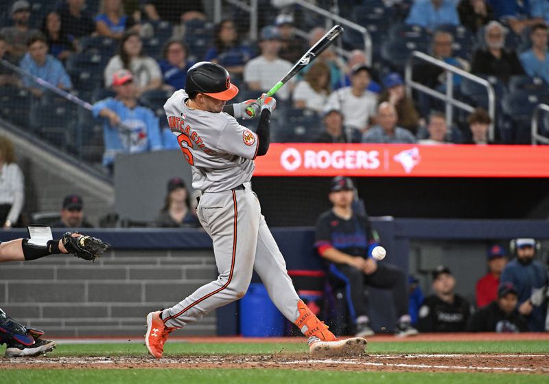 Aug 8, 2024; Toronto, Ontario, CAN; Baltimore Orioles first base Ryan Mountcastle (6) hits an infield single in the ninth inning against the Toronto Blue Jays at Rogers Centre. Mandatory Credit: Gerry Angus-USA TODAY Sports
