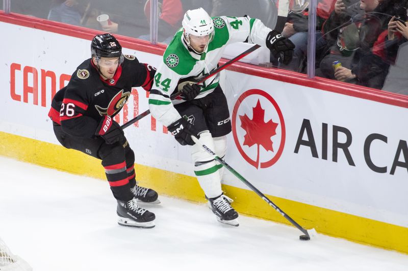 Feb 22, 2024; Ottawa, Ontario, CAN; Ottawa Senators defenseman Erik Brannstrom (26) battles with Dallas Stars defenseman Joel Hanley (44) in the third period at the Canadian Tire Centre. Mandatory Credit: Marc DesRosiers-USA TODAY Sports